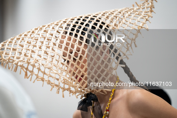 Models wear creations by ISSUE and get ready backstage before walking on the runway during Day 3 of Bangkok International Fashion Week at Si...