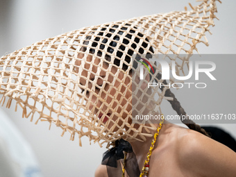 Models wear creations by ISSUE and get ready backstage before walking on the runway during Day 3 of Bangkok International Fashion Week at Si...