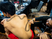 Models wear creations by ISSUE and get ready backstage before walking on the runway during Day 3 of Bangkok International Fashion Week at Si...