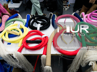 Fashion items that are part of the collection for ISSUE are on a table backstage before the runway show during Day 3 of Bangkok Internationa...