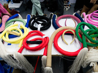 Fashion items that are part of the collection for ISSUE are on a table backstage before the runway show during Day 3 of Bangkok Internationa...