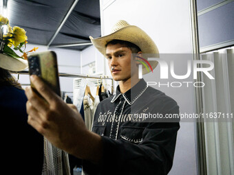 Models prepare backstage before walking on the runway during Day 3 of Bangkok International Fashion Week at Siam Paragon in Bangkok, Thailan...