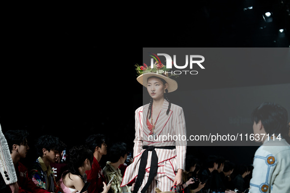 Models showcase creations by ISSUE on the runway on Day 3 of Bangkok International Fashion Week at Siam Paragon in Bangkok, Thailand, on Oct...