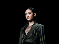 Models showcase creations by ISSUE on the runway on Day 3 of Bangkok International Fashion Week at Siam Paragon in Bangkok, Thailand, on Oct...