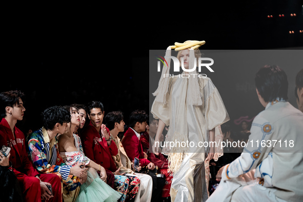 Models showcase creations by ISSUE on the runway on Day 3 of Bangkok International Fashion Week at Siam Paragon in Bangkok, Thailand, on Oct...