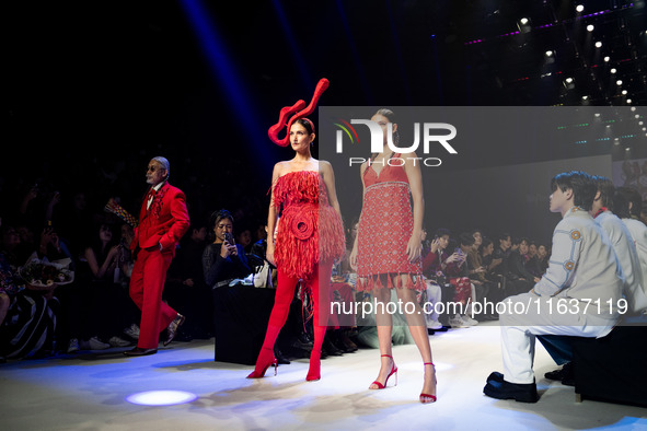 Metinee 'Lukkad' Kingpayom (L) walks the runway in a creation by ISSUE during Day 3 of Bangkok International Fashion Week at Siam Paragon in...