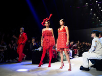 Metinee 'Lukkad' Kingpayom (L) walks the runway in a creation by ISSUE during Day 3 of Bangkok International Fashion Week at Siam Paragon in...