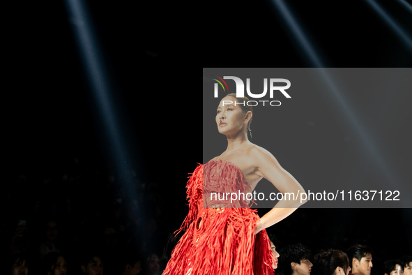 Metinee 'Lukkad' Kingpayom walks the runway in a creation by ISSUE during Day 3 of Bangkok International Fashion Week at Siam Paragon in Ban...