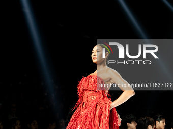 Metinee 'Lukkad' Kingpayom walks the runway in a creation by ISSUE during Day 3 of Bangkok International Fashion Week at Siam Paragon in Ban...