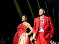 Metinee 'Lukkad' Kingpayom (L) walks the runway in a creation by ISSUE during Day 3 of Bangkok International Fashion Week at Siam Paragon in...