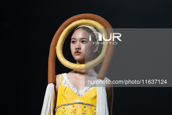 Models showcase creations by ISSUE on the runway on Day 3 of Bangkok International Fashion Week at Siam Paragon in Bangkok, Thailand, on Oct...