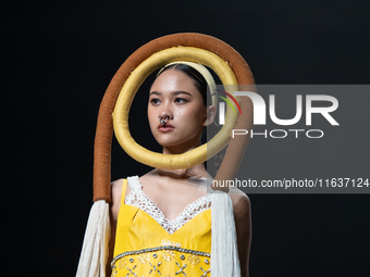 Models showcase creations by ISSUE on the runway on Day 3 of Bangkok International Fashion Week at Siam Paragon in Bangkok, Thailand, on Oct...