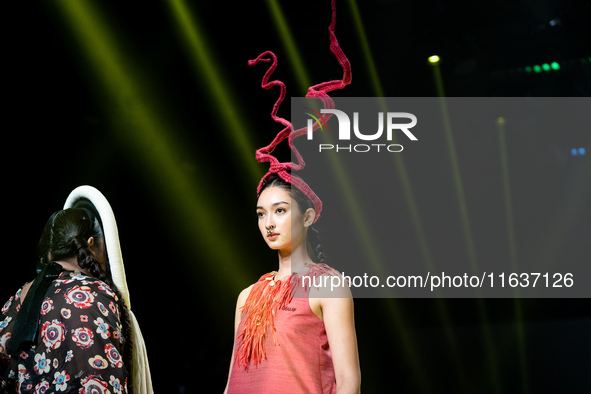 Models showcase creations by ISSUE on the runway on Day 3 of Bangkok International Fashion Week at Siam Paragon in Bangkok, Thailand, on Oct...