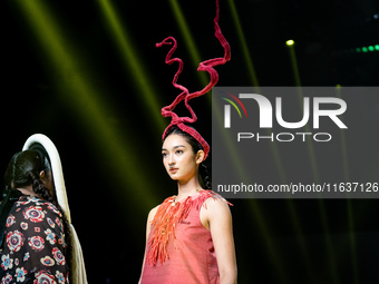 Models showcase creations by ISSUE on the runway on Day 3 of Bangkok International Fashion Week at Siam Paragon in Bangkok, Thailand, on Oct...