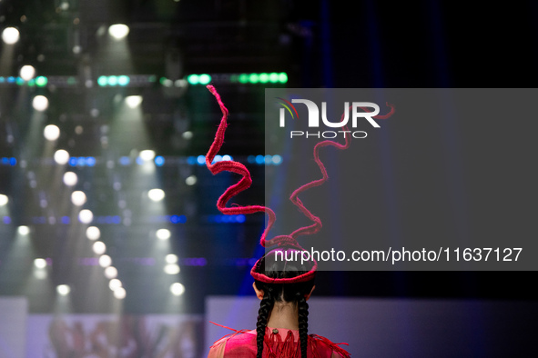 Models showcase creations by ISSUE on the runway on Day 3 of Bangkok International Fashion Week at Siam Paragon in Bangkok, Thailand, on Oct...