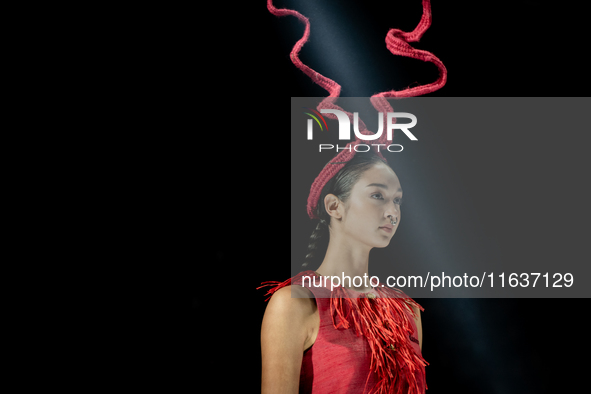 Models showcase creations by ISSUE on the runway on Day 3 of Bangkok International Fashion Week at Siam Paragon in Bangkok, Thailand, on Oct...