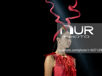 Models showcase creations by ISSUE on the runway on Day 3 of Bangkok International Fashion Week at Siam Paragon in Bangkok, Thailand, on Oct...