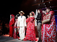 Models stand with Bhubawit 'Roj' Kritpholnara, designer of ISSUE, on the runway on Day 3 of Bangkok International Fashion Week at Siam Parag...