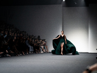 Models showcase creations by POEM on the runway during Day 3 of Bangkok International Fashion Week at Siam Paragon in Bangkok, Thailand, on...