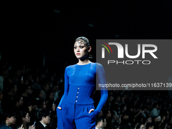 Models showcase creations by POEM on the runway during Day 3 of Bangkok International Fashion Week at Siam Paragon in Bangkok, Thailand, on...