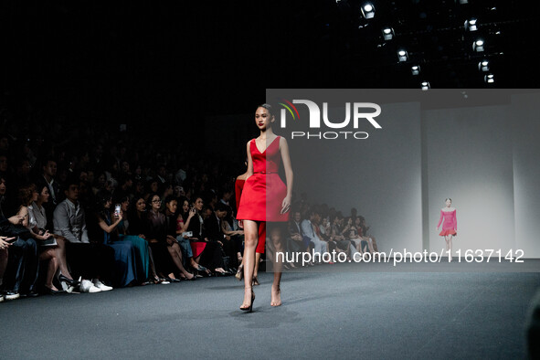 Models showcase creations by POEM on the runway during Day 3 of Bangkok International Fashion Week at Siam Paragon in Bangkok, Thailand, on...