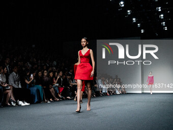 Models showcase creations by POEM on the runway during Day 3 of Bangkok International Fashion Week at Siam Paragon in Bangkok, Thailand, on...