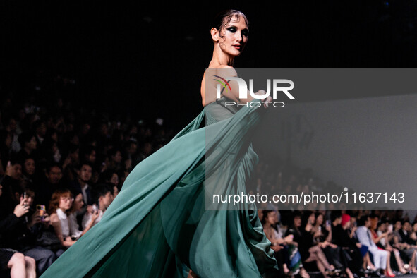 Models showcase creations by POEM on the runway during Day 3 of Bangkok International Fashion Week at Siam Paragon in Bangkok, Thailand, on...