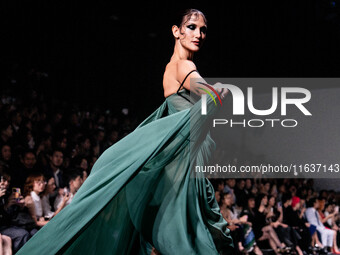 Models showcase creations by POEM on the runway during Day 3 of Bangkok International Fashion Week at Siam Paragon in Bangkok, Thailand, on...