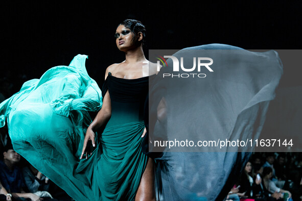 Models showcase creations by POEM on the runway during Day 3 of Bangkok International Fashion Week at Siam Paragon in Bangkok, Thailand, on...