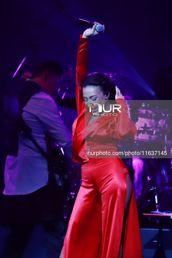 Jass Reyes, singer of the Mexican pop band Playa Limbo, performs on stage as part of their tour to promote the new album ''Hora Cero'' at th...