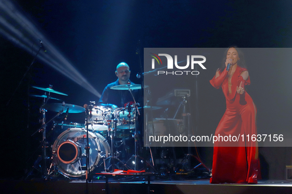 Jass Reyes, singer of the Mexican pop band Playa Limbo, performs on stage as part of their tour to promote the new album ''Hora Cero'' at th...