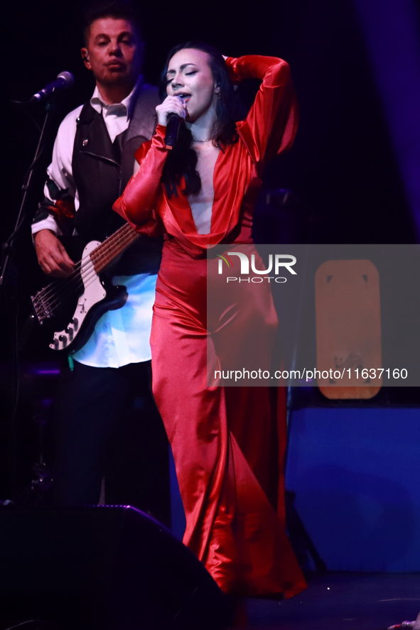 Jass Reyes, singer of the Mexican pop band Playa Limbo, performs on stage as part of their tour to promote the new album ''Hora Cero'' at th...