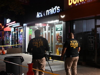 New York City Police Department crime scene investigators mark evidence discovered at the scene where former Governor of New York David Pate...