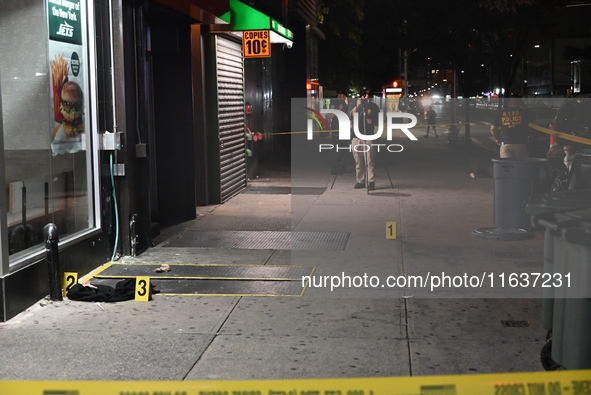 New York City Police Department crime scene investigators mark evidence discovered at the scene where former Governor of New York David Pate...