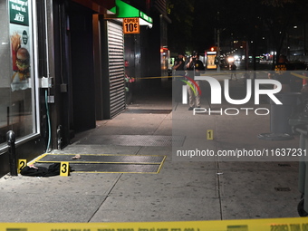 New York City Police Department crime scene investigators mark evidence discovered at the scene where former Governor of New York David Pate...