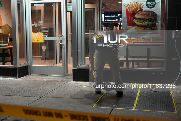 New York City Police Department crime scene investigators mark evidence discovered at the scene where former Governor of New York David Pate...