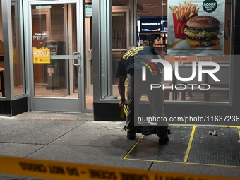 New York City Police Department crime scene investigators mark evidence discovered at the scene where former Governor of New York David Pate...