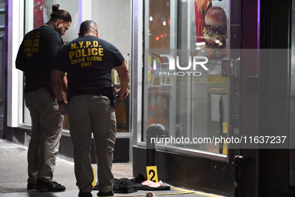 New York City Police Department crime scene investigators mark evidence discovered at the scene where former Governor of New York David Pate...