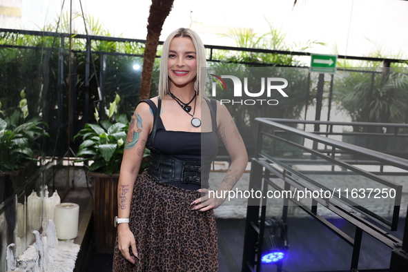 Any Barrios poses for photos during the 'Podcast Linea Morada' press conference at Terraza Bichicori in Mexico City, Mexico, on October 4, 2...