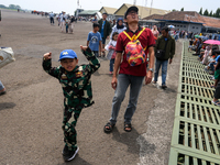 A number of residents visit the TNI Transport Aircraft Static Show event to commemorate the 79th Anniversary of the TNI at Husein Sastranega...