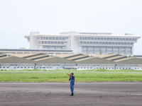 A soldier is on duty during the TNI Transport Aircraft Static Show event to commemorate the 79th Anniversary of the TNI at Husein Sastranega...