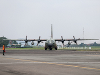 Aircraft land during the TNI Transport Aircraft Static Show event to commemorate the 79th Anniversary of the TNI at Husein Sastranegara Air...