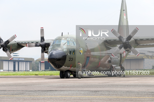 The crew exits the aircraft during the TNI Transport Aircraft Static Show event to commemorate the 79th Anniversary of the TNI at Husein Sas...