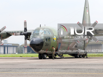 The crew exits the aircraft during the TNI Transport Aircraft Static Show event to commemorate the 79th Anniversary of the TNI at Husein Sas...