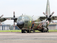 The crew exits the aircraft during the TNI Transport Aircraft Static Show event to commemorate the 79th Anniversary of the TNI at Husein Sas...