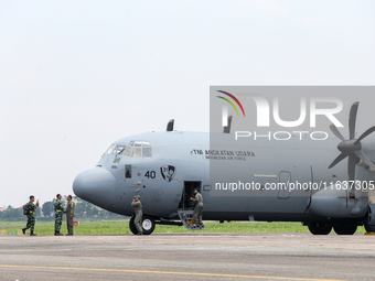 The crew exits the aircraft during the TNI Transport Aircraft Static Show event to commemorate the 79th Anniversary of the TNI at Husein Sas...