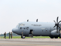 The crew exits the aircraft during the TNI Transport Aircraft Static Show event to commemorate the 79th Anniversary of the TNI at Husein Sas...