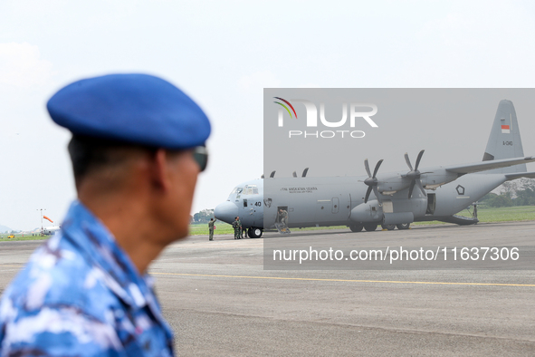 The crew exits the aircraft during the TNI Transport Aircraft Static Show event to commemorate the 79th Anniversary of the TNI at Husein Sas...