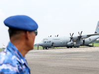 The crew exits the aircraft during the TNI Transport Aircraft Static Show event to commemorate the 79th Anniversary of the TNI at Husein Sas...