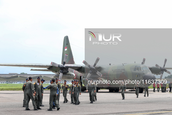 A number of soldiers exit the aircraft during the TNI Transport Aircraft Static Show event to commemorate the 79th Anniversary of the TNI at...